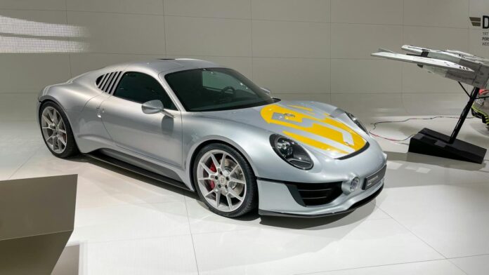 a silver car parked in a showroom